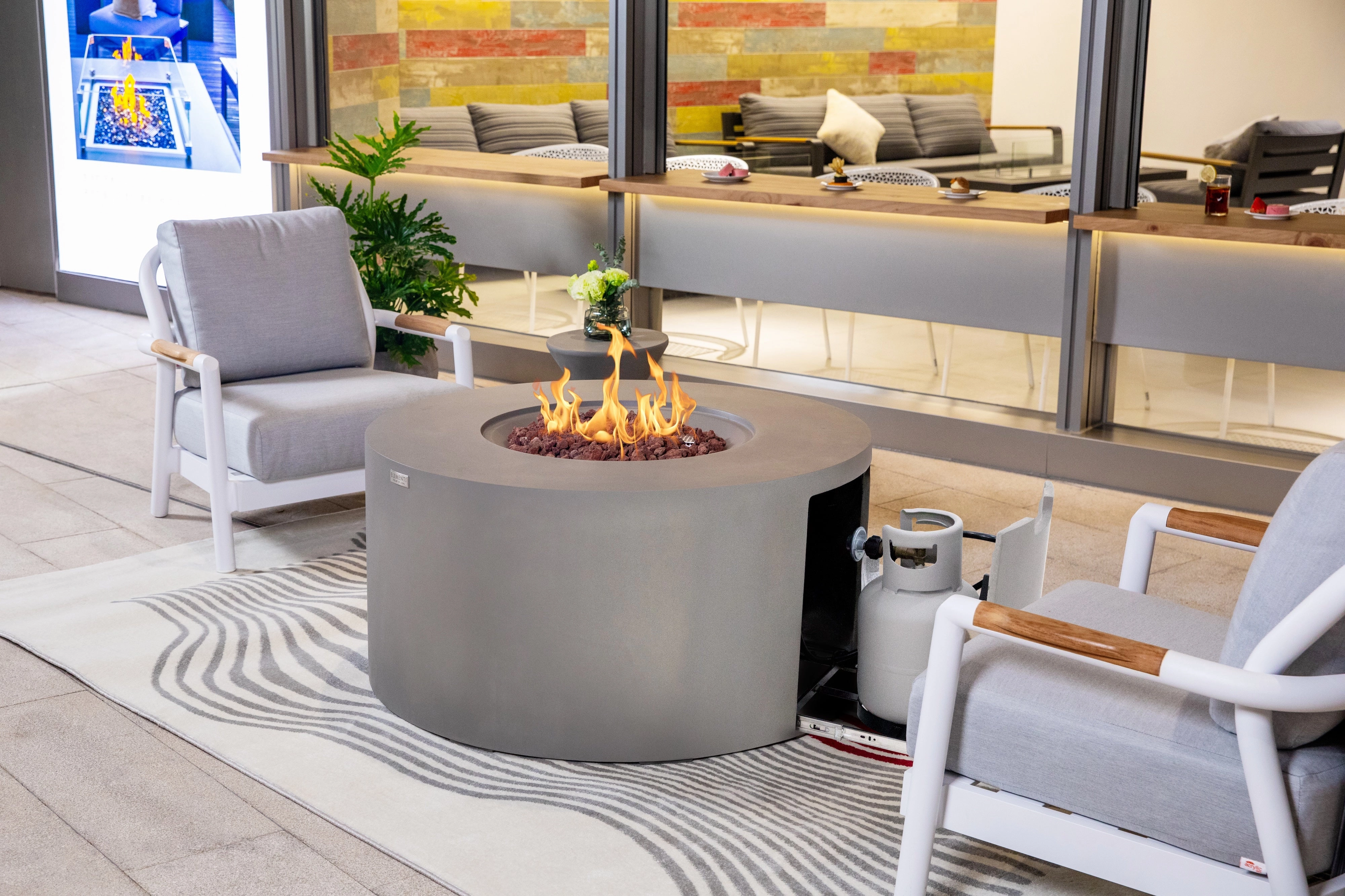Elementi - Pacaya Round Concreate Fire Pit Table, Hidden Propane Storage OFG311